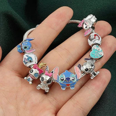 Colorful silver-tone charm bracelet shown in a hand