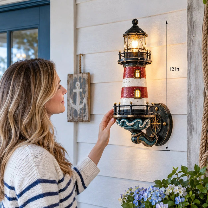 Vintage lighthouse wall light shown beside person for scale