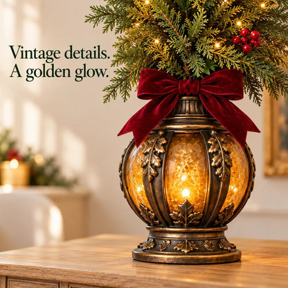 Close-up of the vintage lantern base with amber glow and burgundy bow