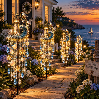 Several matching solar lighthouse lights lining a garden walkway